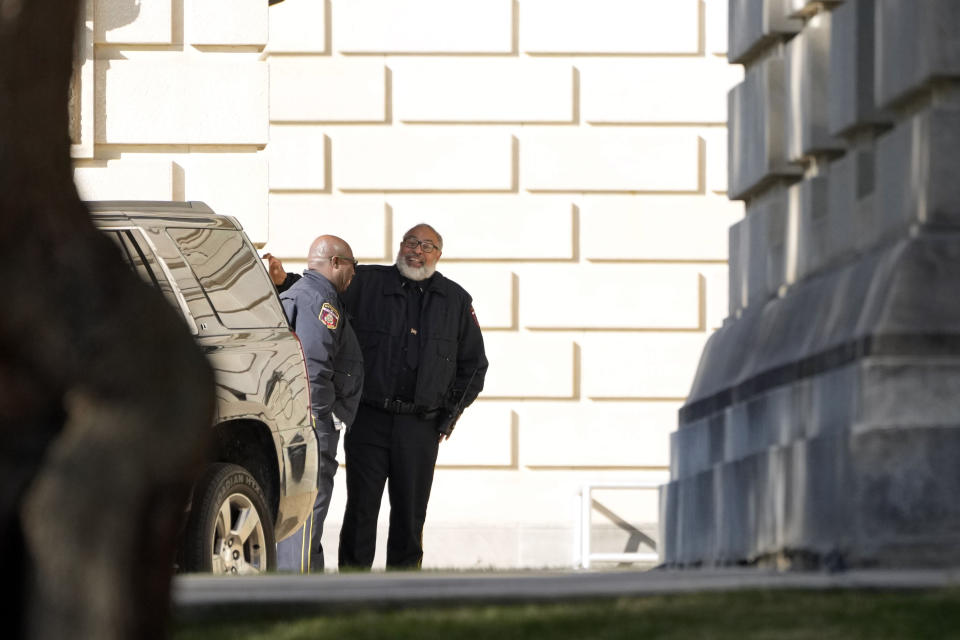 Capitol Police officers stand outside the Mississippi State Capitol in Jackson, Miss., Thursday, Jan. 4, 2024, as they deal with a second consecutive day of bomb threats to the state house and to the Carroll Gartin Justice Building, which houses the state supreme and appellate courts. (AP Photo/Rogelio V. Solis)