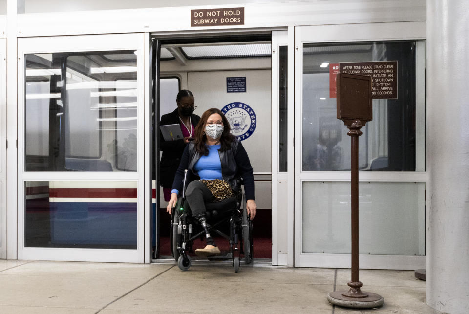 UNITED STATES - MARCH 24: Sen. Tammy Duckworth, D-Ill., arrives on the Senate subway for a vote in the Capitol on Wednesday, March 24, 2021. (Photo By Bill Clark/CQ-Roll Call, Inc via Getty Images)