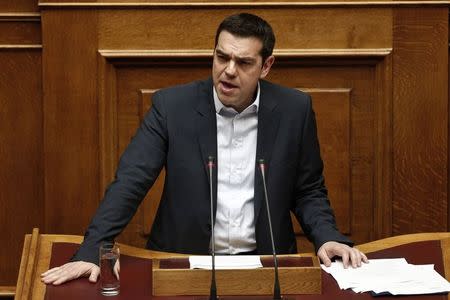 Greek Prime Minister Alexis Tsipras delivers his first major speech in parliament in Athens February 8, 2015. REUTERS/ Alkis Konstantinidis