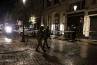 Belgian soldiers patrol a along a street during a high level of security situation following the recent deadly Paris attacks, in Brussels, Belgium, November 22, 2015. REUTERS/Youssef Boudlal