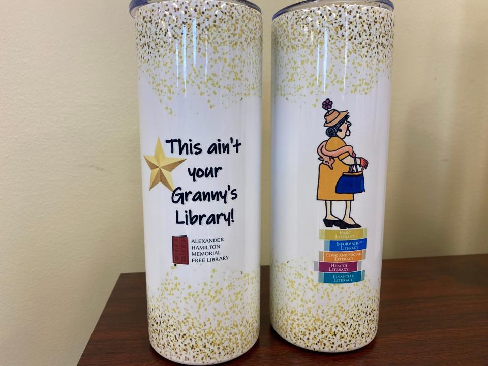 Alexander Hamilton Memorial Free Library staff members received travel mugs saying ‘This ain’t your Granny’s Library!’ at an Oct. 18 celebration of the Waynesboro library’s recognition by the PA Forward program of the Pennsylvania Library Association.