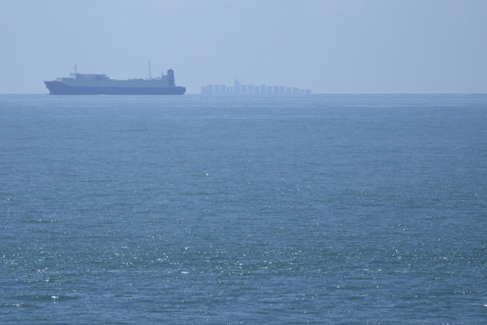 FILE - Ships move through the Taiwan Strait as seen from the 68-nautical-mile scenic spot, the closest point in mainland China to the island of Taiwan, in Pingtan in southeastern China's Fujian Province, on Aug. 5, 2022. Warning of a new wave of panic, Taiwan on Tuesday, Feb. 20, 2024, protested antagonist China’s boarding of a tourist boat as tensions rise around the Kinmen archipelago that lies just off the Chinese coast but is controlled by Taiwan. (AP Photo/Ng Han Guan, File)