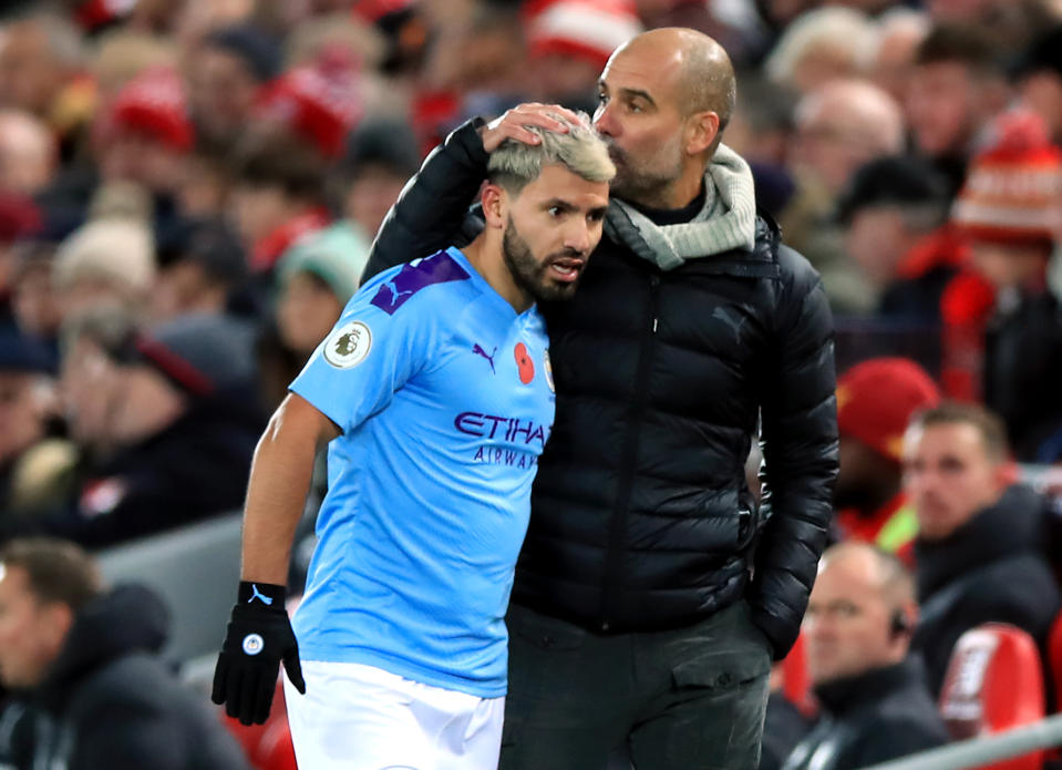 Pep Guardiola (right), Sergio Aguero and Manchester City have their eyes on chasing down Liverpool again. (Photo by Peter Byrne/PA Images via Getty Images)