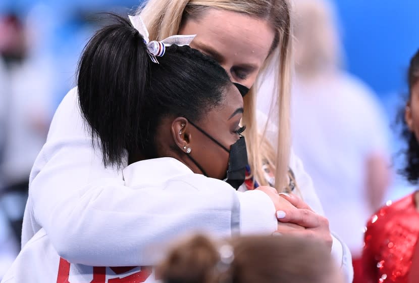 -TOKYO,JAPAN July 26, 2021: USA's Simone Biles is consoled after competing on the vault and withdrawing from competition due to an injury in the women's team final at the 2020 Tokyo Olympics. (Wally Skalij /Los Angeles Times)