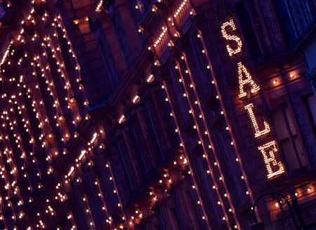 FILE PHOTO: An illuminated sale sign is seen on the exterior of the Harrods department store in London, Britain, January 10, 2019. REUTERS/Toby Melville