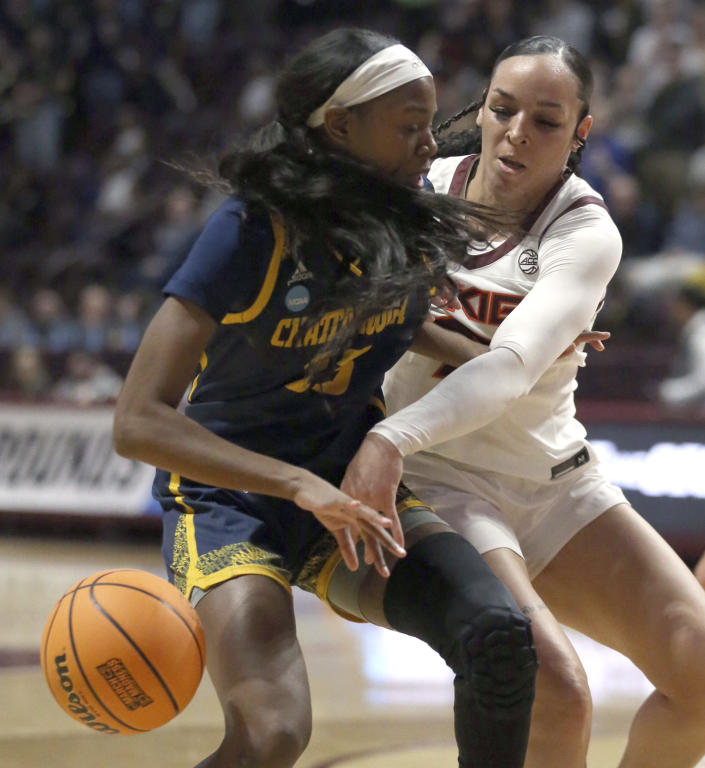 Chattanooga's Yazz Wazeerud-Din, left, has the ball tipped from her by Virginia Tech's Kayana Traylor during the first quarter of a first-round college basketball game in the women's NCAA Tournament, Friday, March 17, 2023, in Blacksburg, Va. (Matt Gentry/The Roanoke Times via AP)
