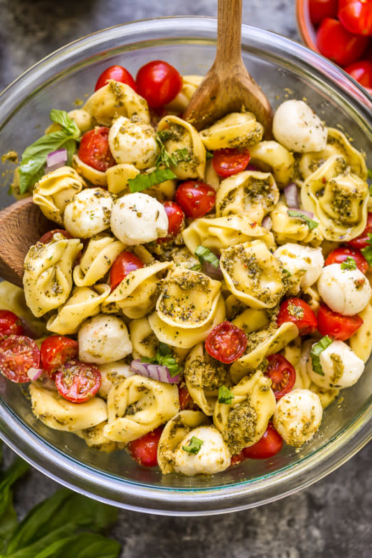 <p>Baker by Nature</p><p>This easy pesto tortellini pasta salad is ready in about 10 minutes! Made with just basic 5 ingredients you probably have in the kitchen right now!</p><p><strong>Get the recipe: <a href="https://bakerbynature.com/easy-pesto-tortellini-pasta-salad/" rel="nofollow noopener" target="_blank" data-ylk="slk:Easy Pesto Tortellini Pasta Salad;elm:context_link;itc:0;sec:content-canvas" class="link ">Easy Pesto Tortellini Pasta Salad</a></strong></p>