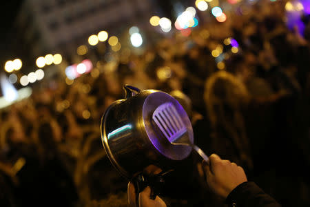 Women bang pots and pans during a protest at the start of a nationwide feminist strike on International Women's Day at Puerta del Sol Square in Madrid, Spain, March 8, 2019.REUTERS/Susana Vera