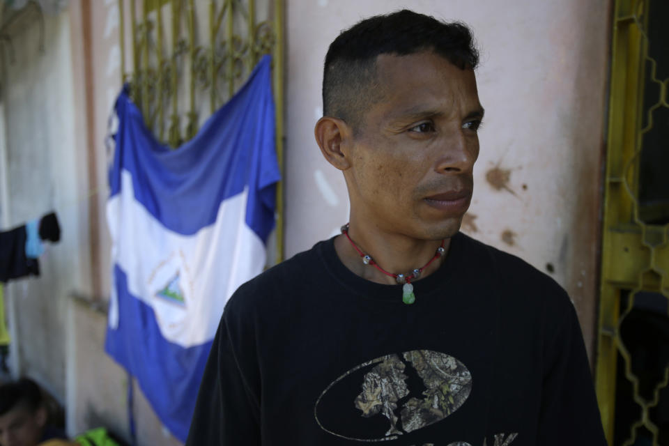 In this Oct. 23, 2018 photo, Nicaraguan Lester Javier Velasquez Gonzalez poses for a photo in Huixtla, Mexico. Amid thousands of mostly Honduran migrants fleeing poverty and gang violence, Velasquez Gonzalez says political persecution and death await him and his family back in Nicaragua. (AP Photo/Moises Castillo)