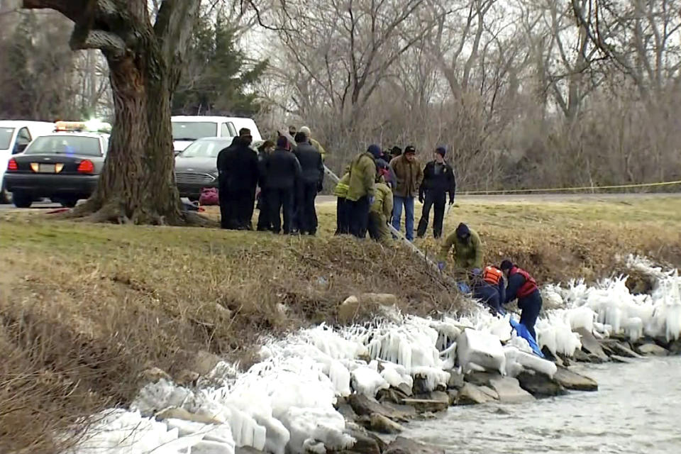 In this undated image made from a video by KWTV-DT, rescue crew recover a body from Lake Overholser in Oklahoma City, Okla. Authorities are trying to determine whether three bodies that have been discovered in or near an Oklahoma City-area lake in less than two weeks are connected. The body of 18-year-old Kelvin Perez-Lopez was pulled from Lake Overholser on Feb. 23. On March 2, the body of a teen or young adult was discovered along the lake's southernmost edge. That body has not been identified. The third body was discovered Tuesday in a wooded area near the lake. (KWTV-DT via AP)