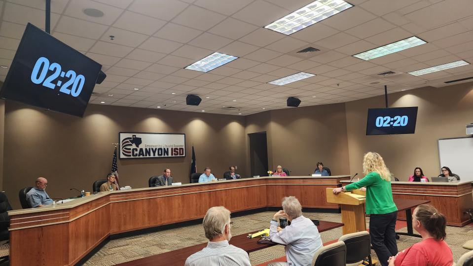 An attendee of the Canyon ISD meeting addresses the school board Monday in Canyon.