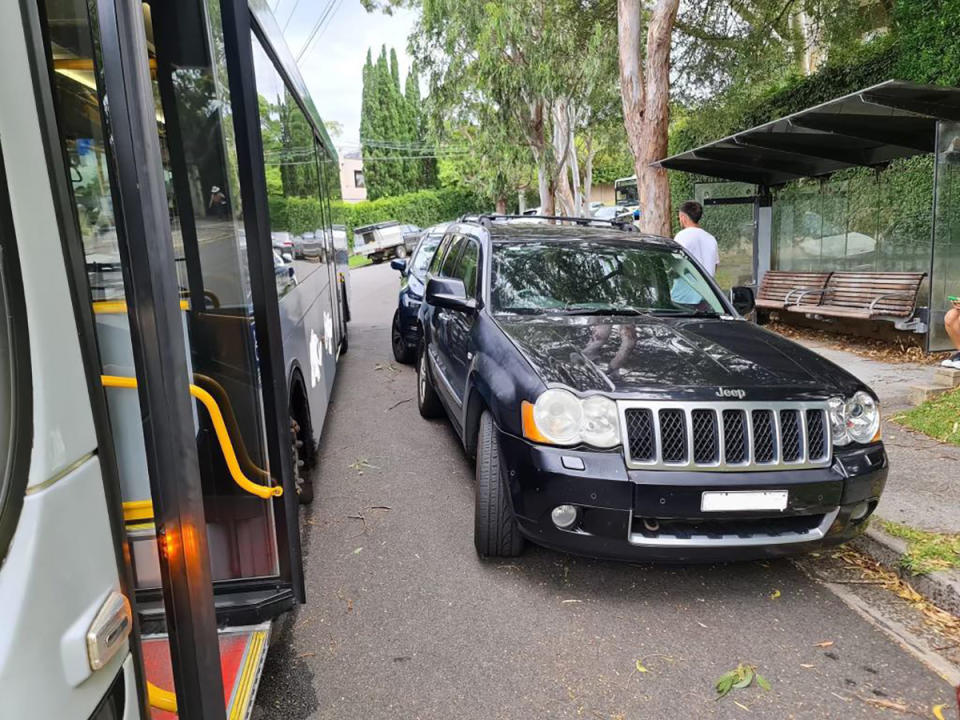 The Jeep parked in front of the bus stop in Sydney, blocking off access on the narrow road.