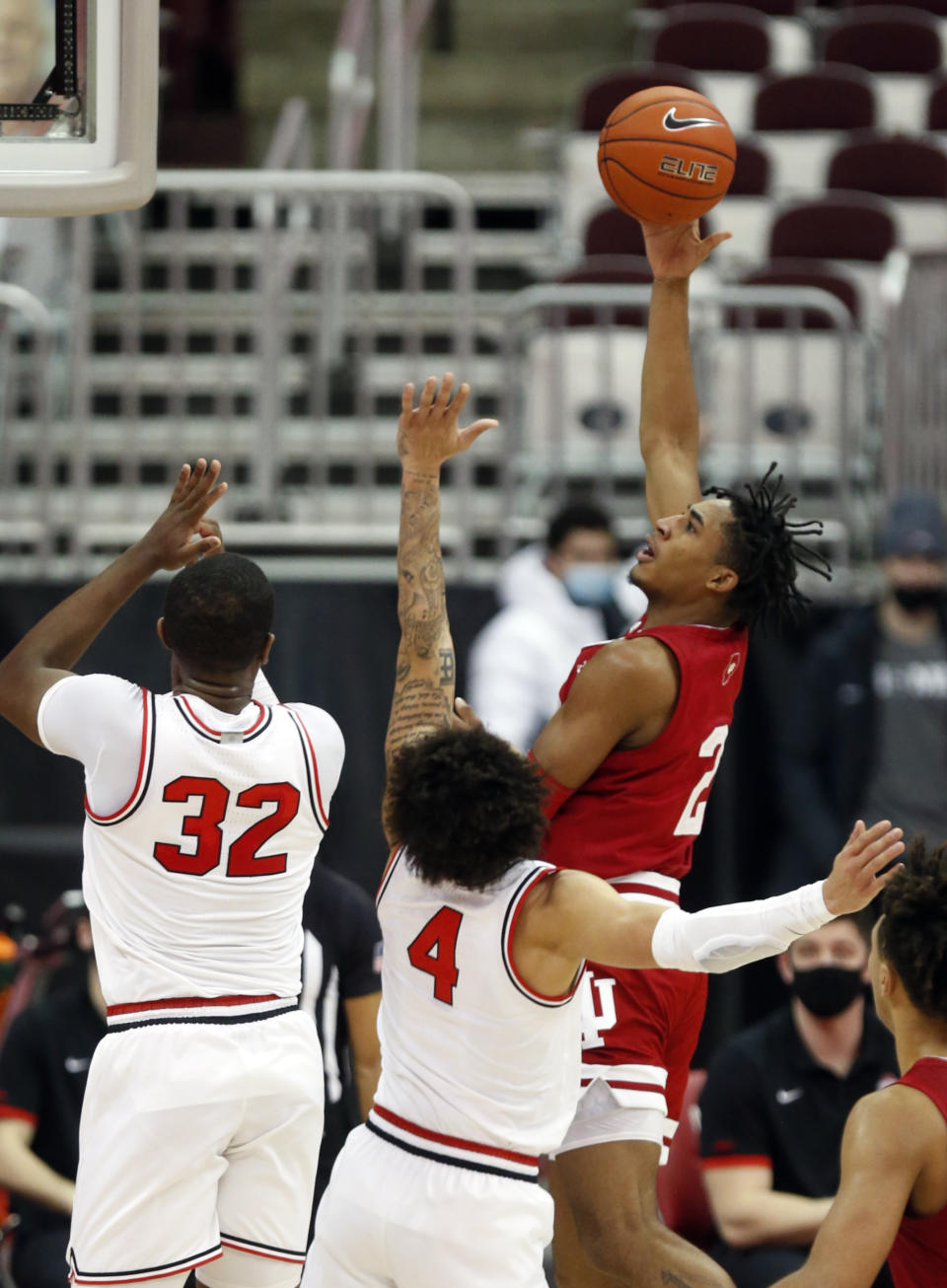 Indiana guard Armaan Franklin, left, goes up for a shot against Ohio State forward E.J. Liddell, left, and guard Duane Washington during the first half of an NCAA college basketball game in Columbus, Ohio, Saturday, Feb. 13, 2021. (AP Photo/Paul Vernon)