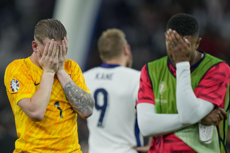 England's goalkeeper Jordan Pickford, left, reacts at the end of the final match between Spain and England at the Euro 2024 soccer tournament in Berlin, Germany, Sunday, July 14, 2024. (AP Photo/Martin Meissner)