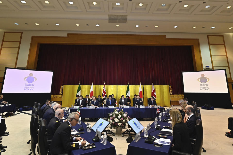 Britain's Defense Minister Grant Shapps, right side, Italy's Defense Minister Guido Crosetto, left side, and Japanese Defense Minister Minoru Kihara, center, attend a trilateral meeting at the defense ministry Thursday, Dec. 14, 2023, in Tokyo, Japan. (David Mareuil/Pool Photo via AP)