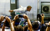 Formula One - F1 - Singapore Grand Prix - Marina Bay, Singapore- 18/9/16 Mercedes' Nico Rosberg of Germany celebrates winning the race. REUTERS/Jeremy Lee