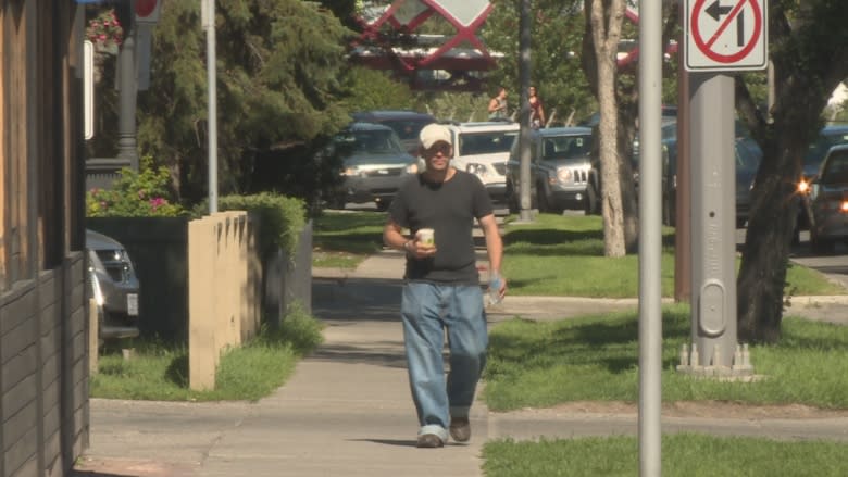 Panhandler says Calgarians generous as cops say keep the change