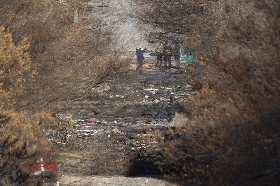 Emergency personnel work at the scene of an explosion in downtown Nashville, Tenn., Friday, Dec. 25, 2020. Buildings shook in the immediate area and beyond after a loud boom was heard early Christmas morning. (AP Photo/Mark Humphrey)