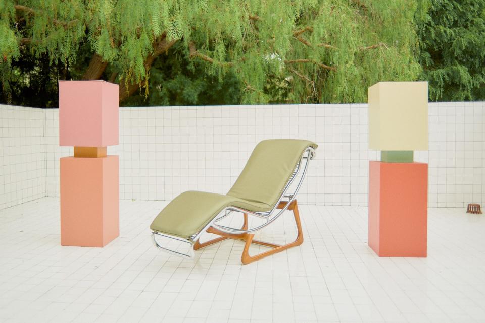 George was inspired by 1980s Mexico City when he added the white tile to the backyard. Two sculptures by Luckey flank a vintage chaise lounge by Gimo Fero.