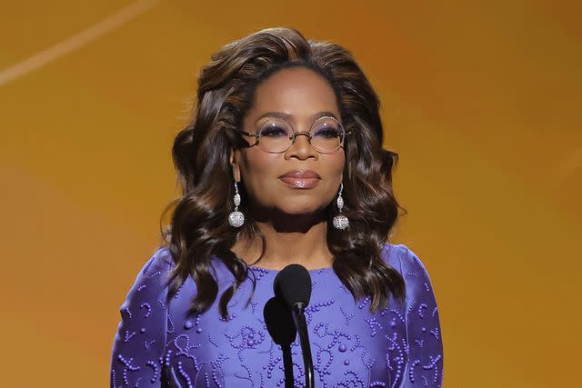 <p>Kevin Winter/Getty</p> Oprah Winfrey takes the stage on March 16, 2024 in Los Angeles.