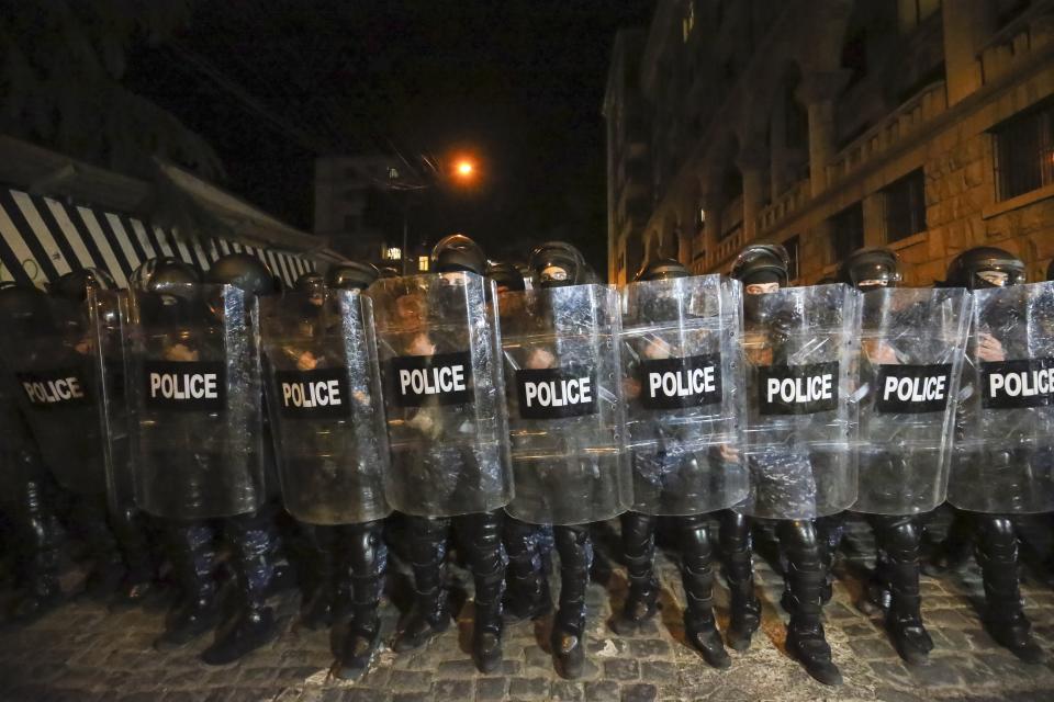 Riot police block opposition protesters who gather to protest against "the Russian law" in Tbilisi, Georgia, on Tuesday, April 30, 2024. Clashes erupted between police and opposition demonstrators protesting a new bill intended to track foreign influence that the opposition denounced as Russia-inspired. (AP Photo/Zurab Tsertsvadze)