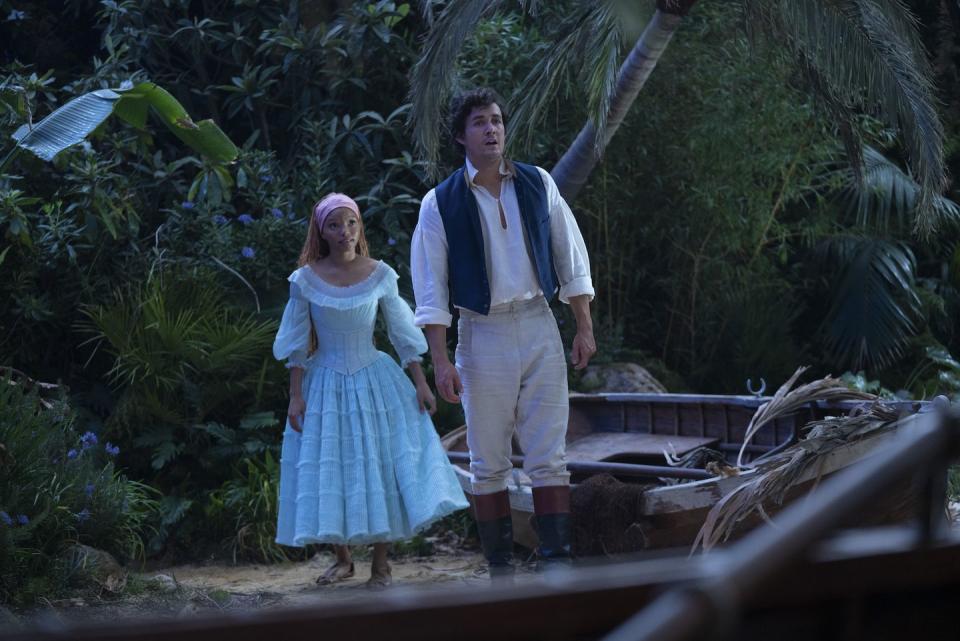 l r halle bailey as ariel and jonah hauer king as prince eric in disney's live action the little mermaid photo by giles keyte © 2023 disney enterprises, inc all rights reserved