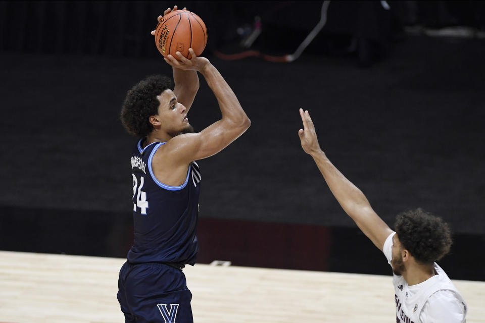 Villanova's Jeremiah Robinson-Earl shoots over Arizona State's Taeshon Cherry during the first half of an NCAA college basketball game Thursday, Nov. 26, 2020, in Uncasville, Conn. (AP Photo/Jessica Hill)