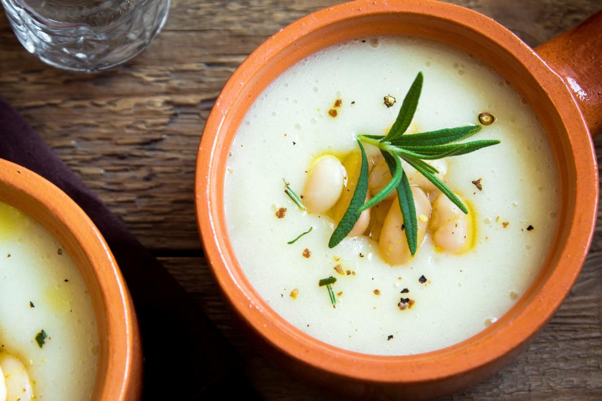 Homemade cauliflower and white bean soup with rosemary and spices - fresh organic vegetable vegetarian vegan diet soup meal food