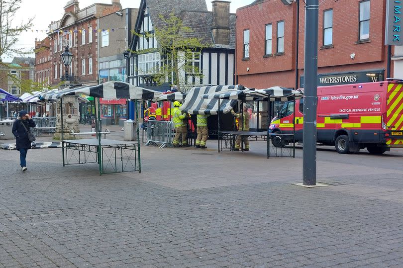 Fire crews dismantle market stalls in Loughborough