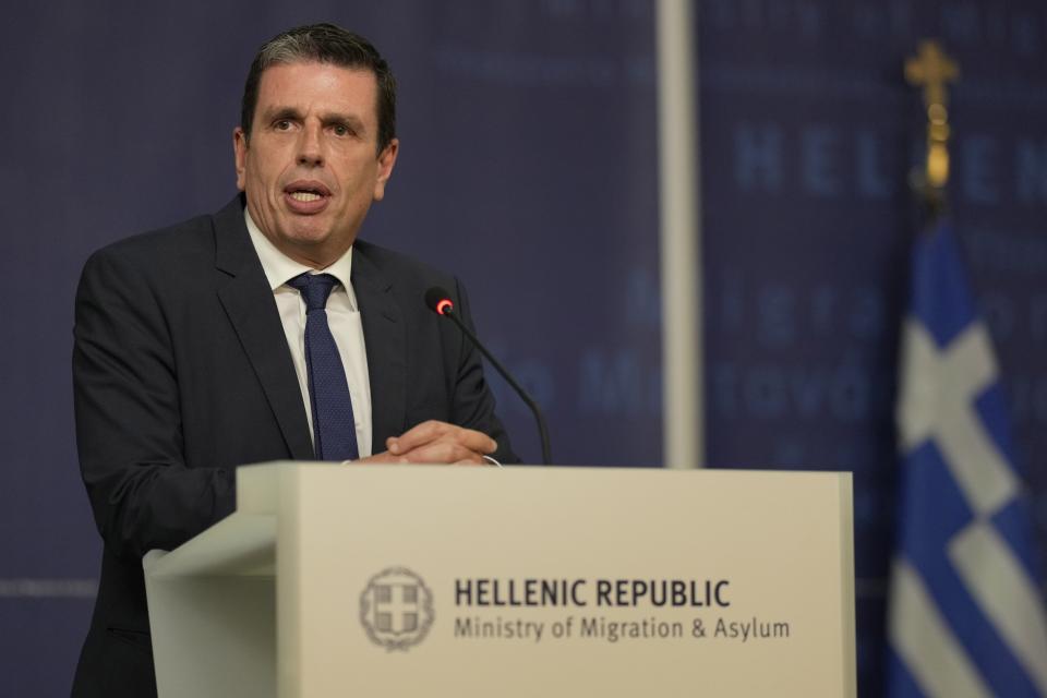 FILE- Newly appointed Migration and Asylum Minister Dimitris Kairidis speaks during a handover ceremony, in Athens, Greece, on Tuesday, June 27, 2023. Greece's minister for migration said on Tuesday, Sept. 26, 2023, that the government is planning a major regularization scheme for undocumented migrants to meet pressing demands in the labor market, despite a recent increase in illegal arrivals. Dimitris Kairidis said the scheme – similar to a 2020 reform in Italy – would target an estimated 300,000 migrants who are undocumented or whose residence permits have expired to help address acute shortages in agriculture, construction and tourism. (AP Photo/Petros Giannakouris, file)