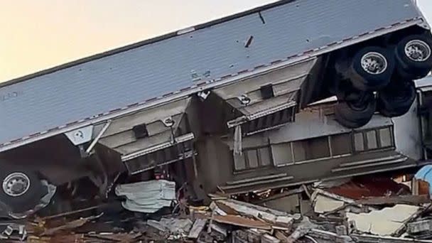 PHOTO: A truck sits on a building after a tornado the previous evening, Mar. 25, 2023 in Rolling Fork, Miss. (Wesley Jackson)