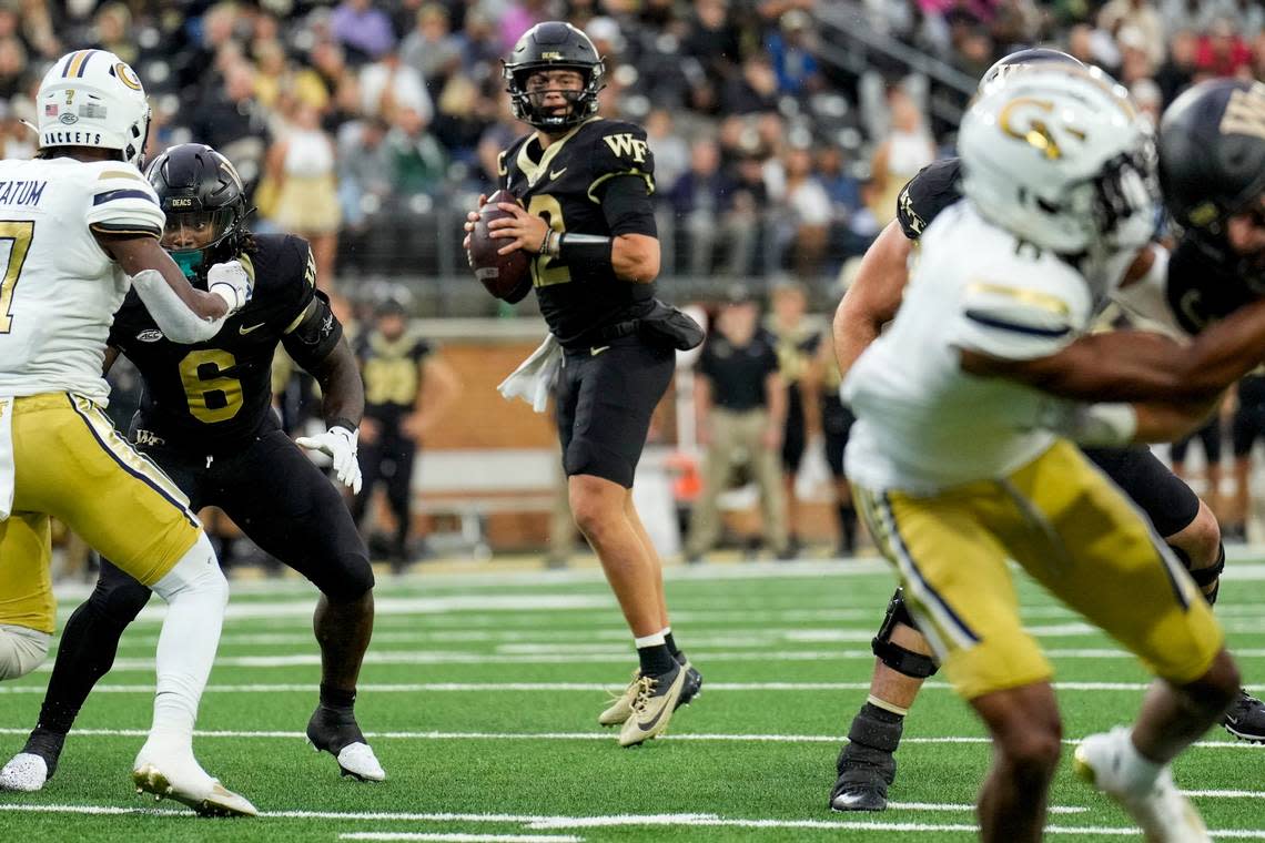 Sep 23, 2023; Winston-Salem, North Carolina, USA; Wake Forest Demon Deacons quarterback Mitch Griffis (12) drops back to pass against the Georgia Tech Yellow Jackets during the first half at Allegacy Federal Credit Union Stadium. Mandatory Credit: Jim Dedmon-USA TODAY Sports