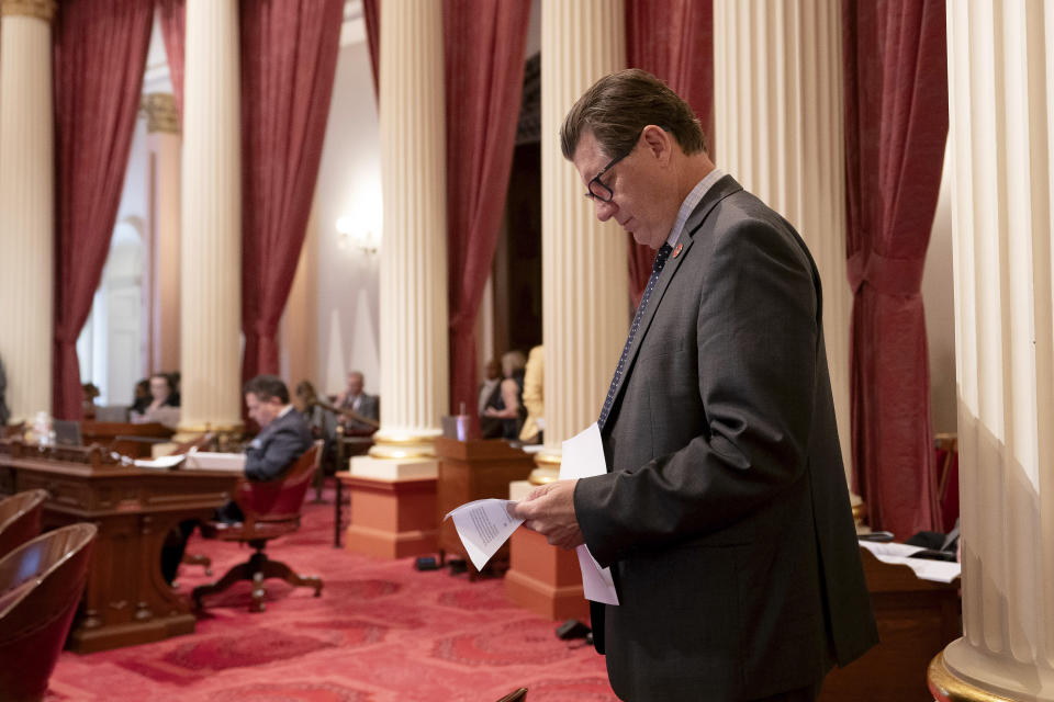 California state Senate Republican Leader Brian Jones, of Santee, looks over some papers during the Senate session at the Capitol in Sacramento, Calif., Tuesday, Sept. 12, 2023. Lawmakers are voting on hundreds of bills before the legislative session concludes for the year on Thursday.(AP Photo/Rich Pedroncelli)