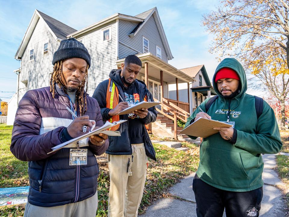 BLOC (Black Leaders Organizing Communities) Ambassadors Chuck Grayson, from left, Martez McGee, and Shannon Jackson Weddle prepare to canvass in the Harambee neighborhood November 14 in Milwaukee.