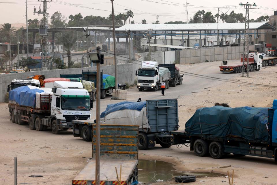 Trucks carrying humanitarian aid enter the southern Gaza Strip from Egypt via the Rafah border crossing on November 19, 2023, amid ongoing battles between Israel and militants from the Palestinian Hamas movement.