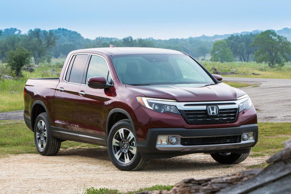 This undated photo provided by Honda shows the Honda Ridgeline, a midsize truck that's one of Edmunds' favorites in the class. While it may not have the off-road capability that some of its competitors do, it's still an excellent choice for camping thanks to all sorts of smart available options and dealer accessories such as a bed-mounted tent. (American Honda Motor Co. via AP)