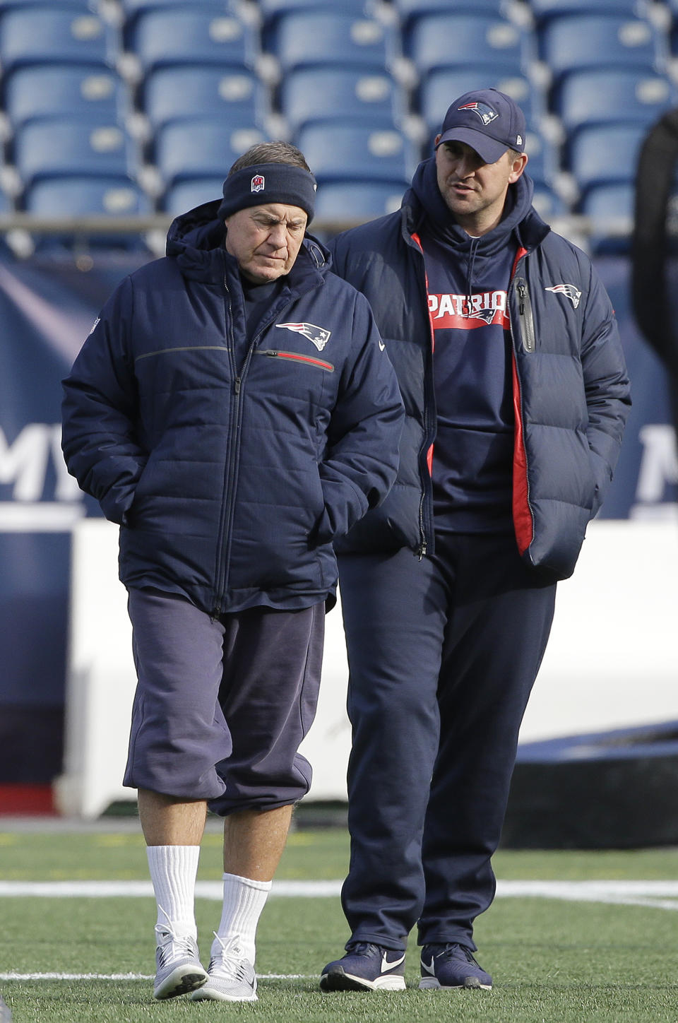 New England Patriots head coach Bill Belichick, left, speaks with special teams coach Joe Judge, right, during NFL football practice, Thursday, Dec. 20, 2018, in Foxborough, Mass. (AP Photo/Steven Senne)
