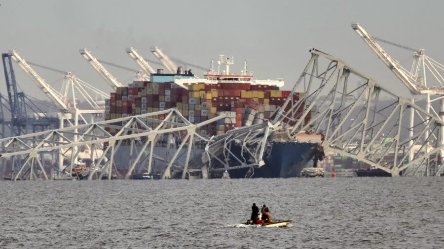 Parts of the Francis Scott Key Bridge remain after a container ship collided with one of the bridge’s supports, Tuesday, March 26, 2024 in Baltimore. The major bridge in Baltimore snapped and collapsed after a container ship rammed into it early Tuesday, and several vehicles fell into the river below. Rescuers were searching for multiple people in the water. (Kaitlin Newman/The Baltimore Banner via AP)