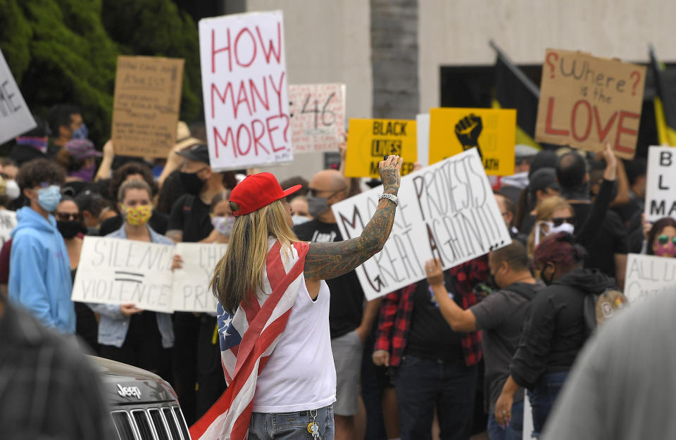 A demonstrator takes a picture of other demonstrators during a protest, Saturday, June 6, 2020, in Simi Valley, Calif., over the death of George Floyd. Floyd died after he was restrained in police custody on Memorial Day in Minneapolis. (AP Photo/Mark J. Terrill)