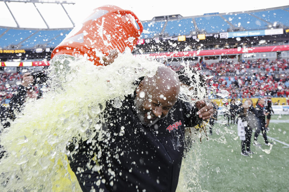 Maryland head coach Mike Locksley is doused after Maryland defeated North Carolina State 16-12 in the Duke's Mayo Bowl NCAA college football game in Charlotte, N.C., Friday, Dec. 30, 2022. (AP Photo/Nell Redmond)