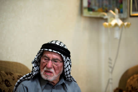 FILE PHOTO: Mohammad Mahmoud Jadallah, a 96-year-old Palestinian from Sur Baher, a village in the suburbs of Arab east Jerusalem, sits in his house during an interview, May 8, 2018. REUTERS/Ronen Zvulun/File Photo