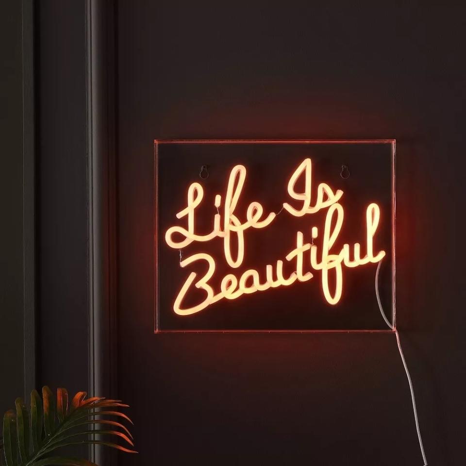 Neon sign with the inscription "Life Is Beautiful" for home decor