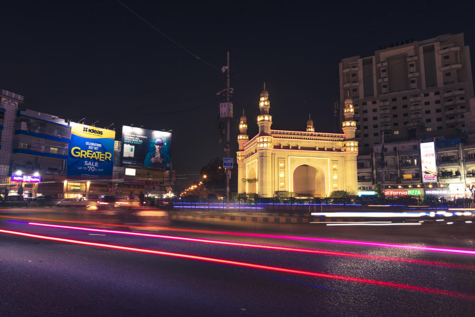 illuminated traffic at night in Karachi, Pakistan