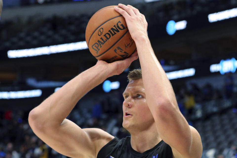 Dallas Mavericks forward Kristaps Porzingis warms up for the team's NBA basketball game against the Los Angeles Lakers on Friday, Jan. 10, 2020, in Dallas. (AP Photo/Richard W. Rodriguez)