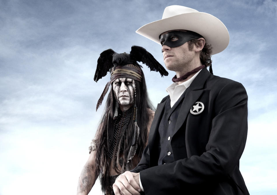 FILE - An undated publicity photo released by Disney/Bruckheimer Films, shows actors, Johnny Depp, left, as Tonto, a spirit warrior on a personal quest, who joins forces in a fight for justice with Armie Hammer, as John Reid, a lawman who has become a masked avenger in the film, 'The Lone Ranger." Clayton Moore's “The Lone Ranger” has lived on for half a century in TV reruns, and the new film reunites the crew behind “Pirates of the Caribbean”: Depp, Disney, director Gore Verbinski and producer Jerry Bruckheimer. The film releases July 3, 2013. (AP Photo/Disney/Bruckheimer Films, Peter Mountain, File)