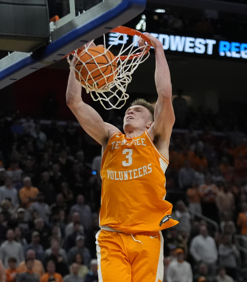 Tennessee guard Dalton Knecht dunks during the first half of an Elite Eight college basketball game against Purdue in the NCAA Tournament, Sunday, March 31, 2024, in Detroit. (AP Photo/Paul Sancya)