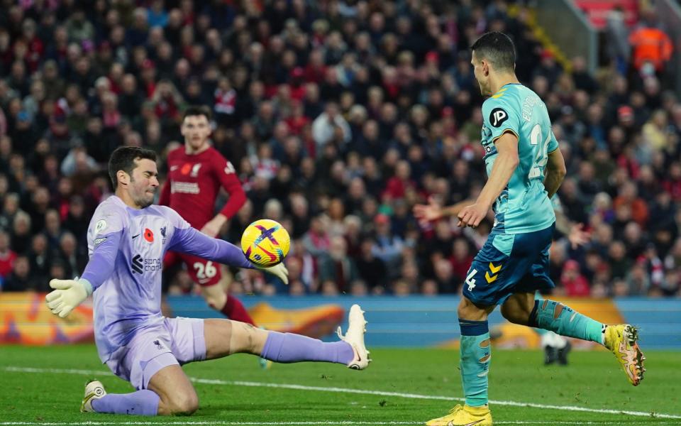 Southampton's Mohamed Elyounoussi (right) has a shot on goal saved by Liverpool goalkeeper Alisson Becker - Nick Potts/PA Wire