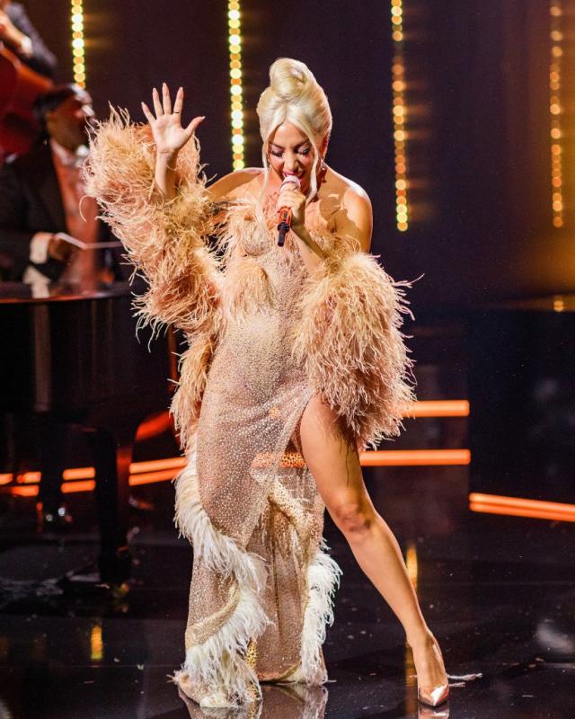 Lady Gaga Returns to Sin City in a Polka Dot Dress & a Boa Made of Money