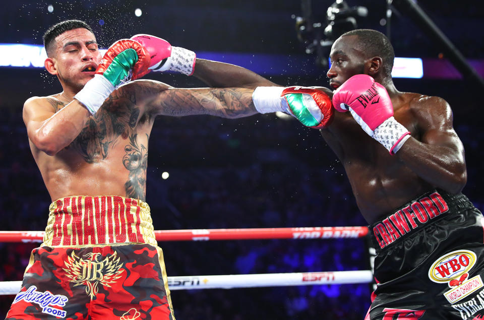 Jose Benavidez Jr. (L) lasted until the twelfth round against Terence Crawford on Saturday in Omaha, Nebraska. (via Top Rank)