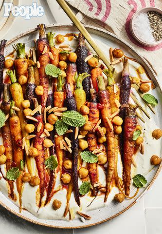 <p>Greg DuPree</p> Beau MacMillan's Honey-Harissa Glazed Carrots & Chickpeas with Feta